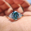 Stunning oval moissanite engagement ring with claw prongs on hand