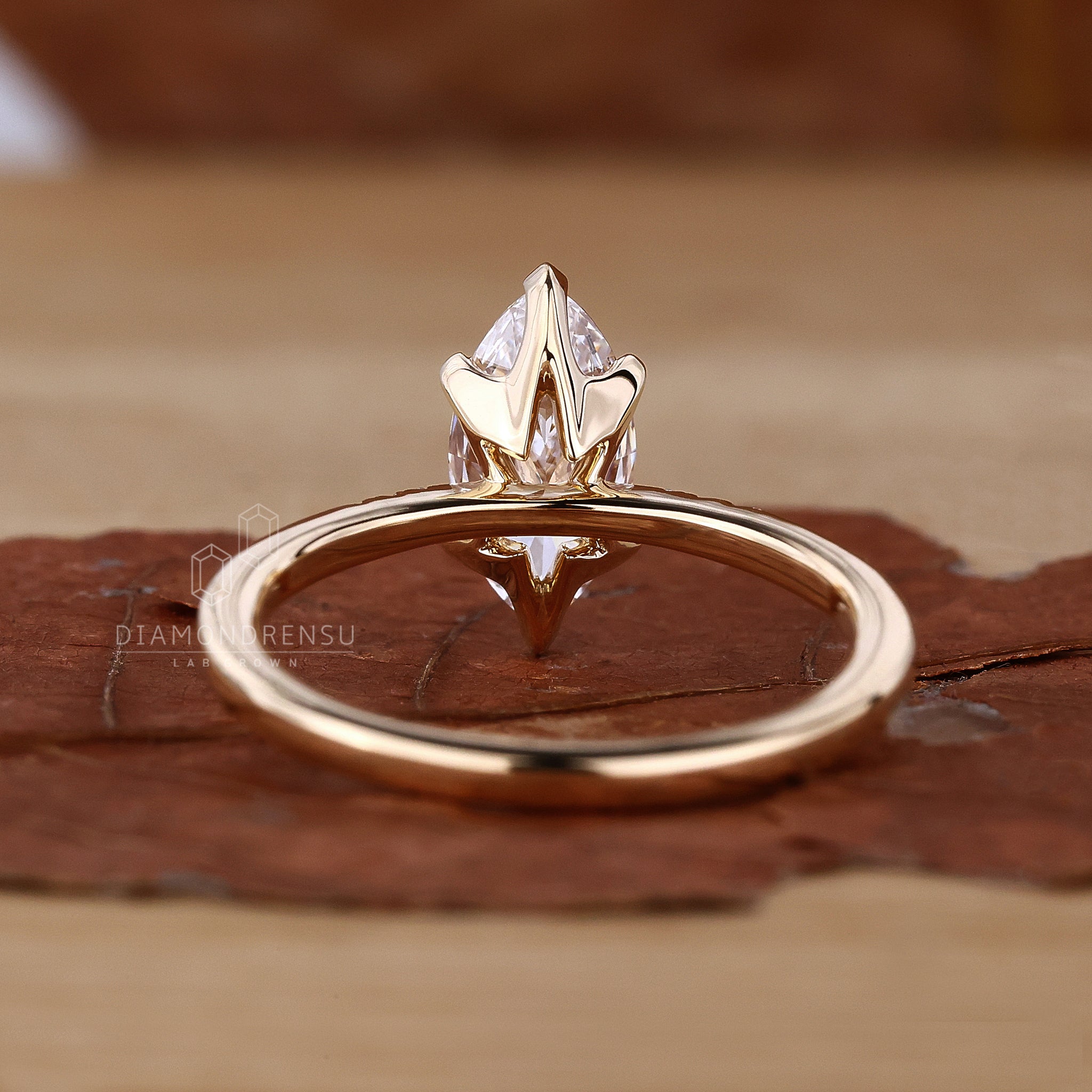 Detailed shot of a marquise diamond ring with a v prong setting, perfect for engagements.