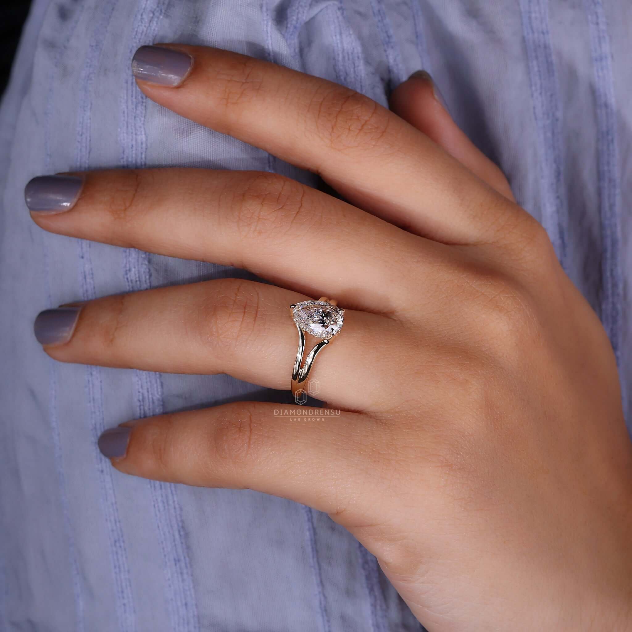 A Hidden Halo Engagement Ring displayed elegantly on a hand.