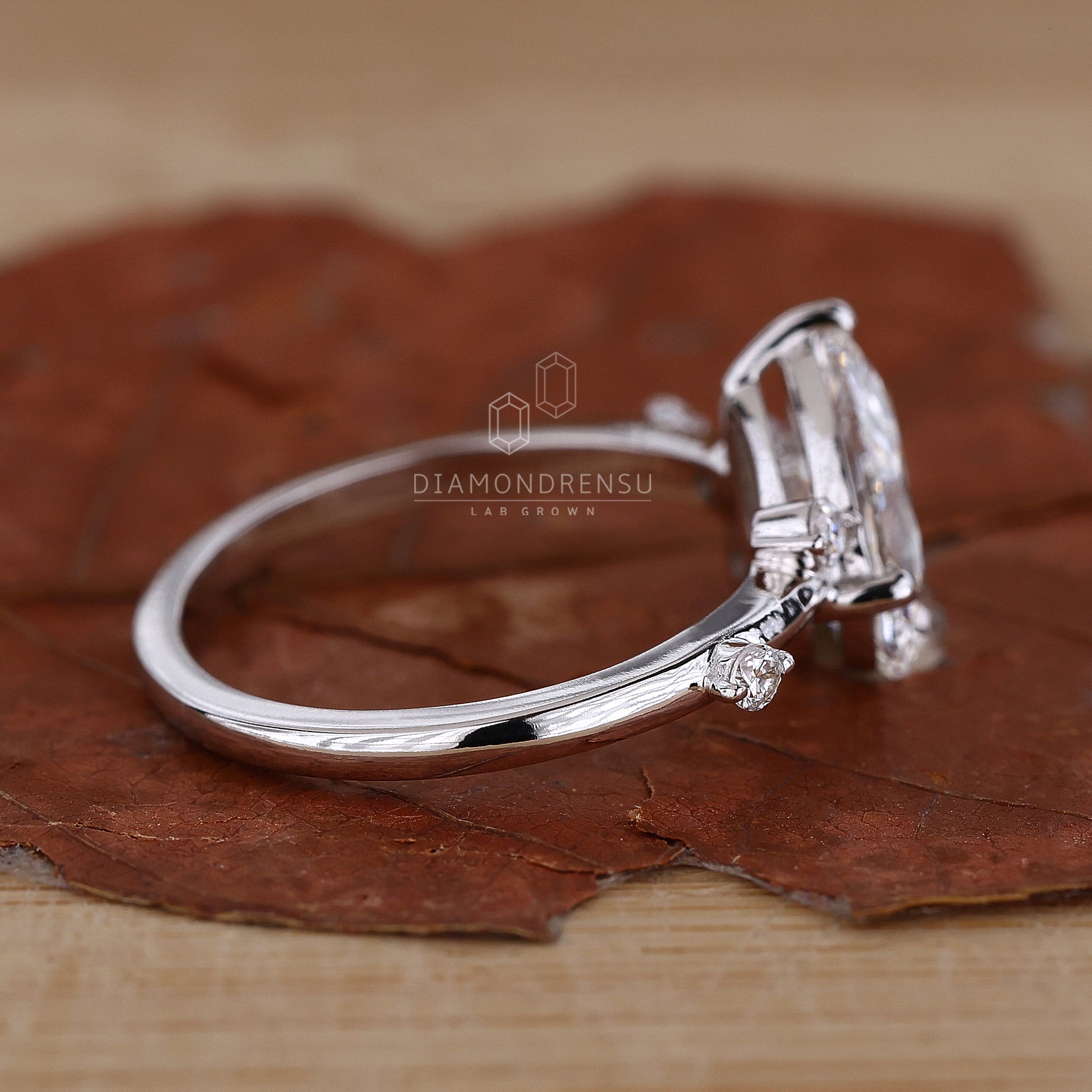 Handmade pear cut diamond engagement ring featuring a stunning basket setting