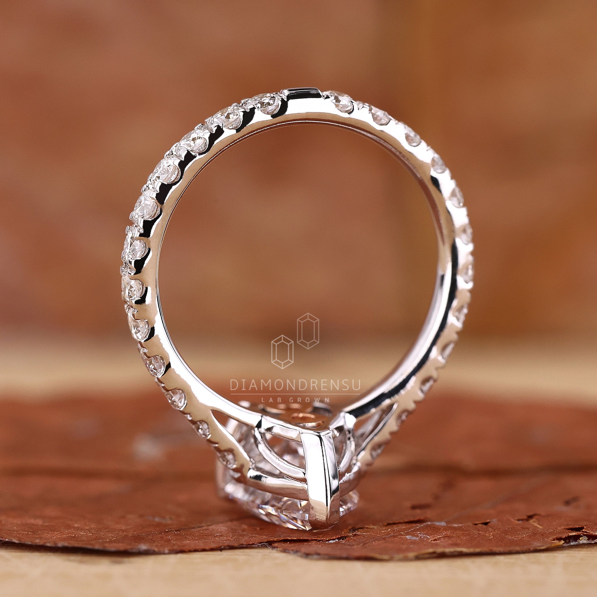 Pear cut engagement ring with a lab grown pear diamond in a basket setting