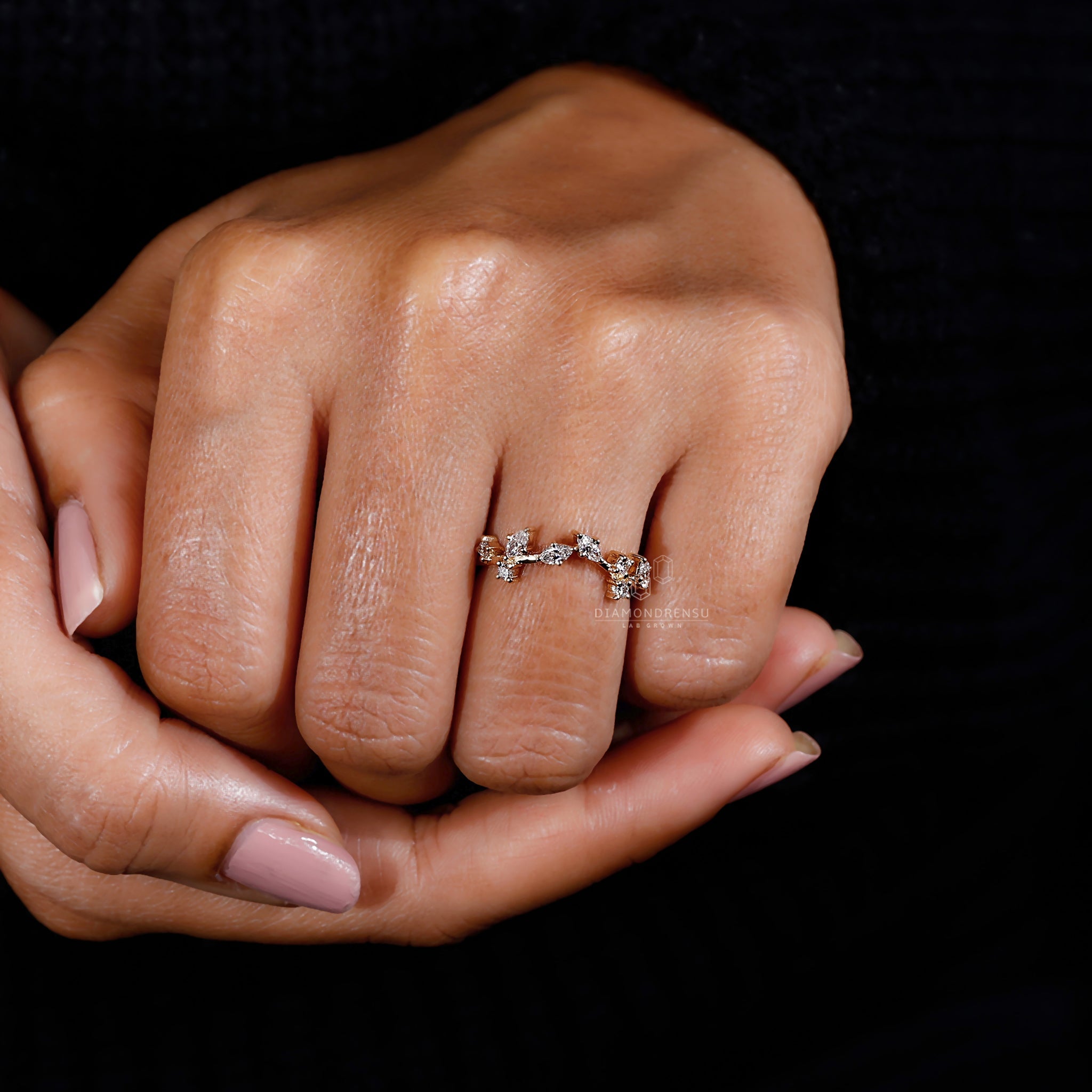 Model displaying a Diamondrensu ring with round and marquise diamonds in a nature-inspired design