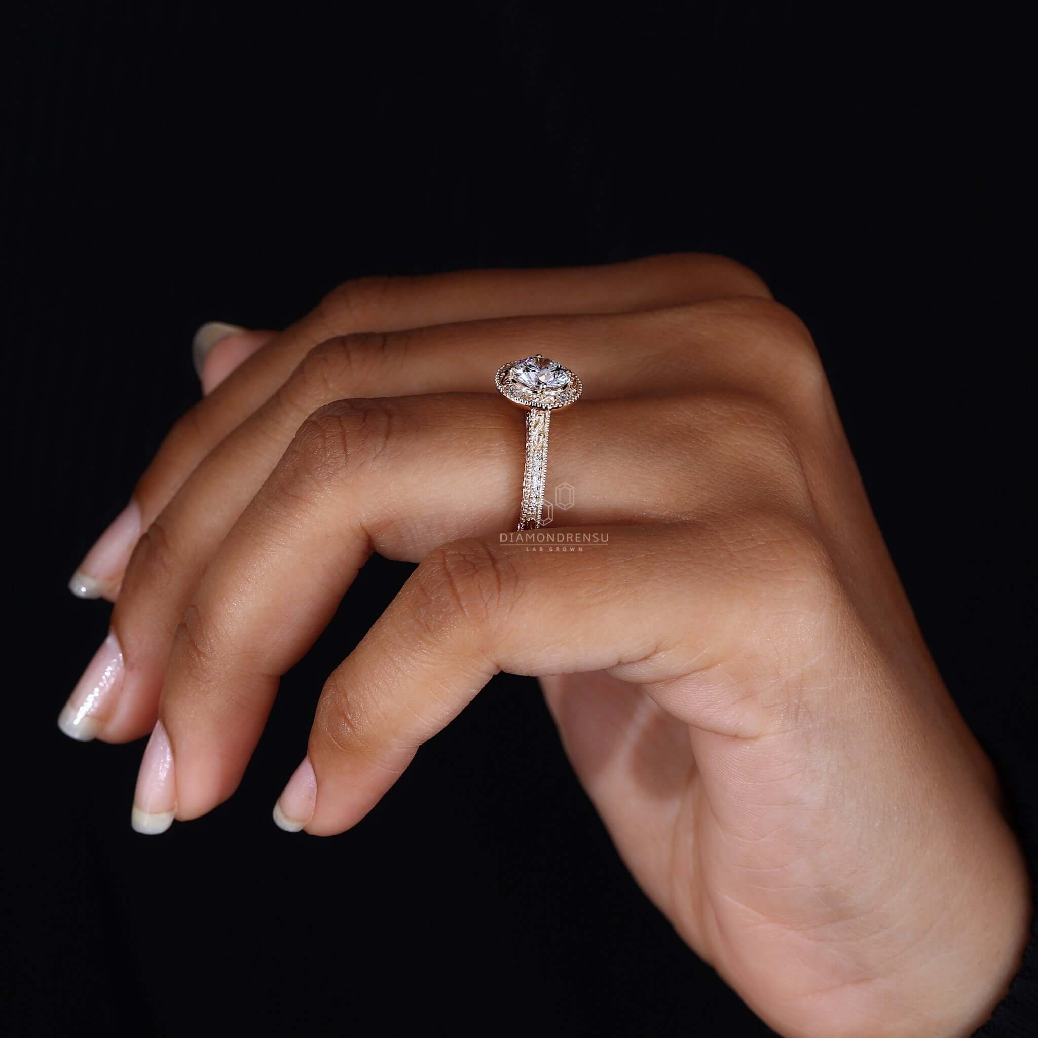 Close-up of a vintage gold ring on hand, highlighting its detailed craftsmanship and vintage charm