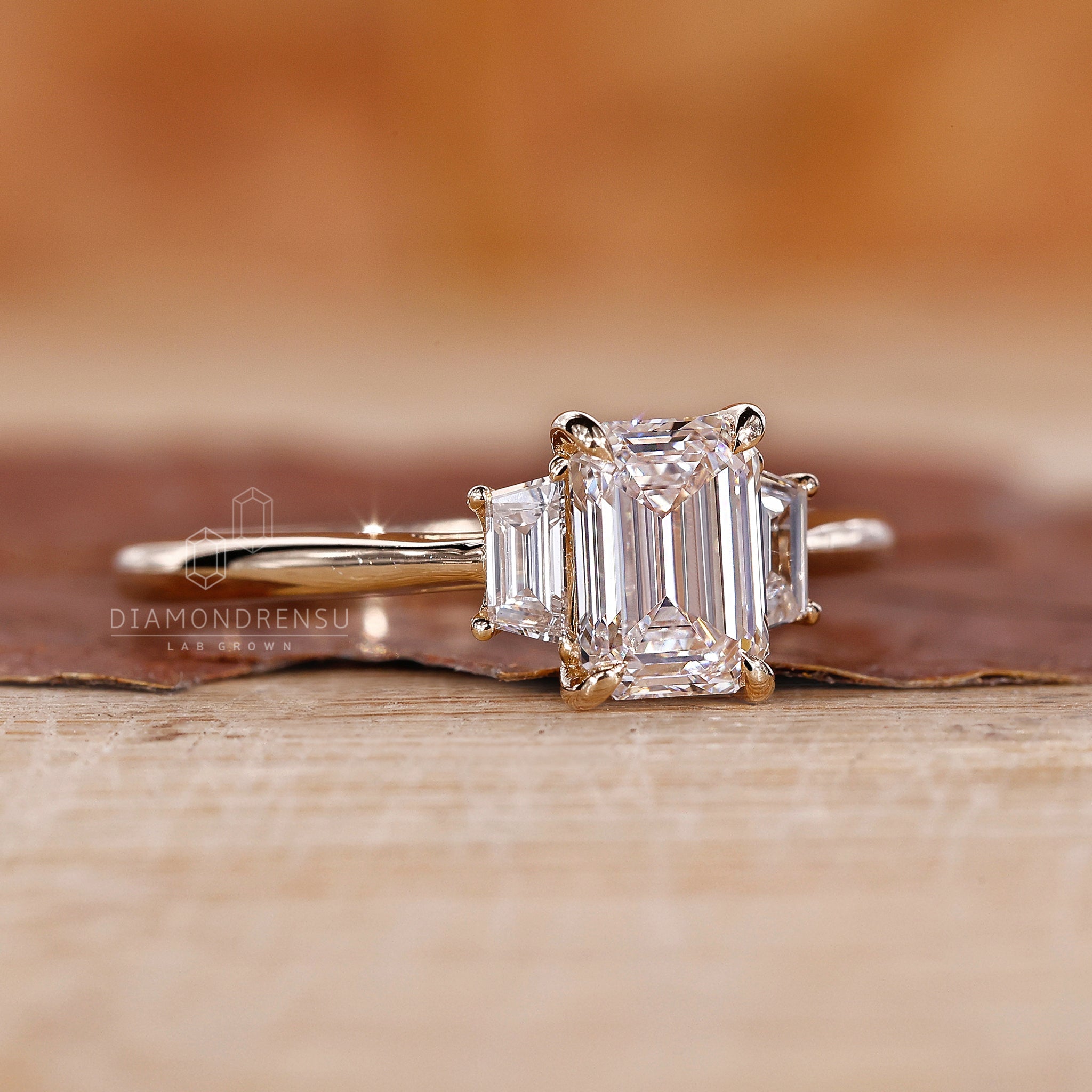 Lab grown engagement ring with emerald cut center diamond and cathedral setting, perfect for a Valentine’s engagement