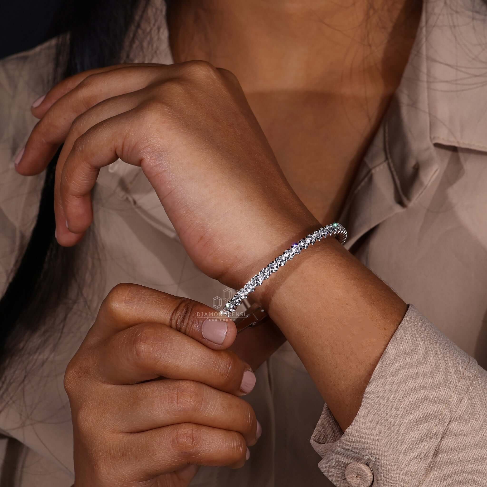 Round diamond bangle bracelet displayed on a jewelry stand