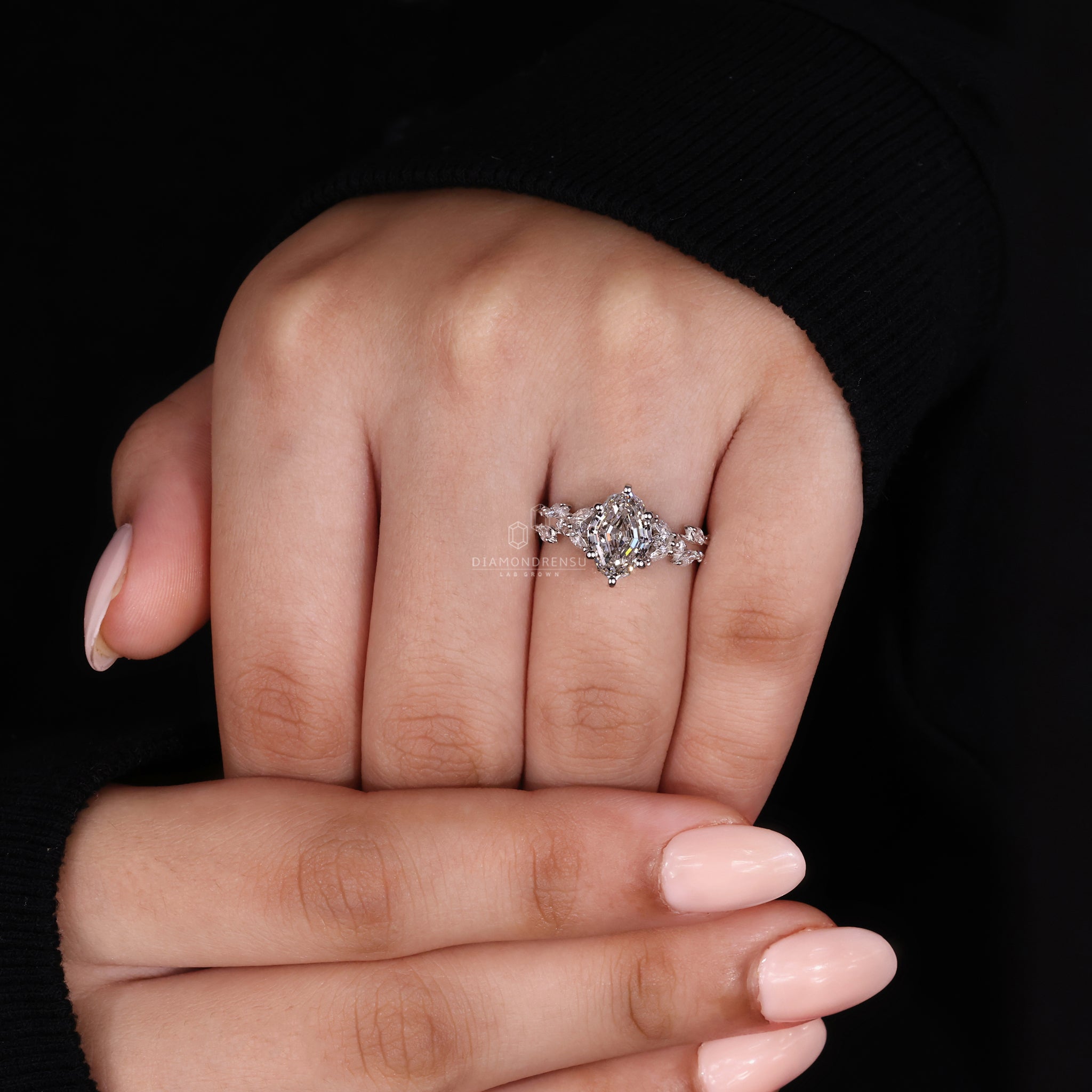 Elegant diamondrensu engagement ring with a nature inspired theme and a sparkling oval diamond.