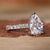 Elegant pear shaped diamond engagement ring on a model's hand