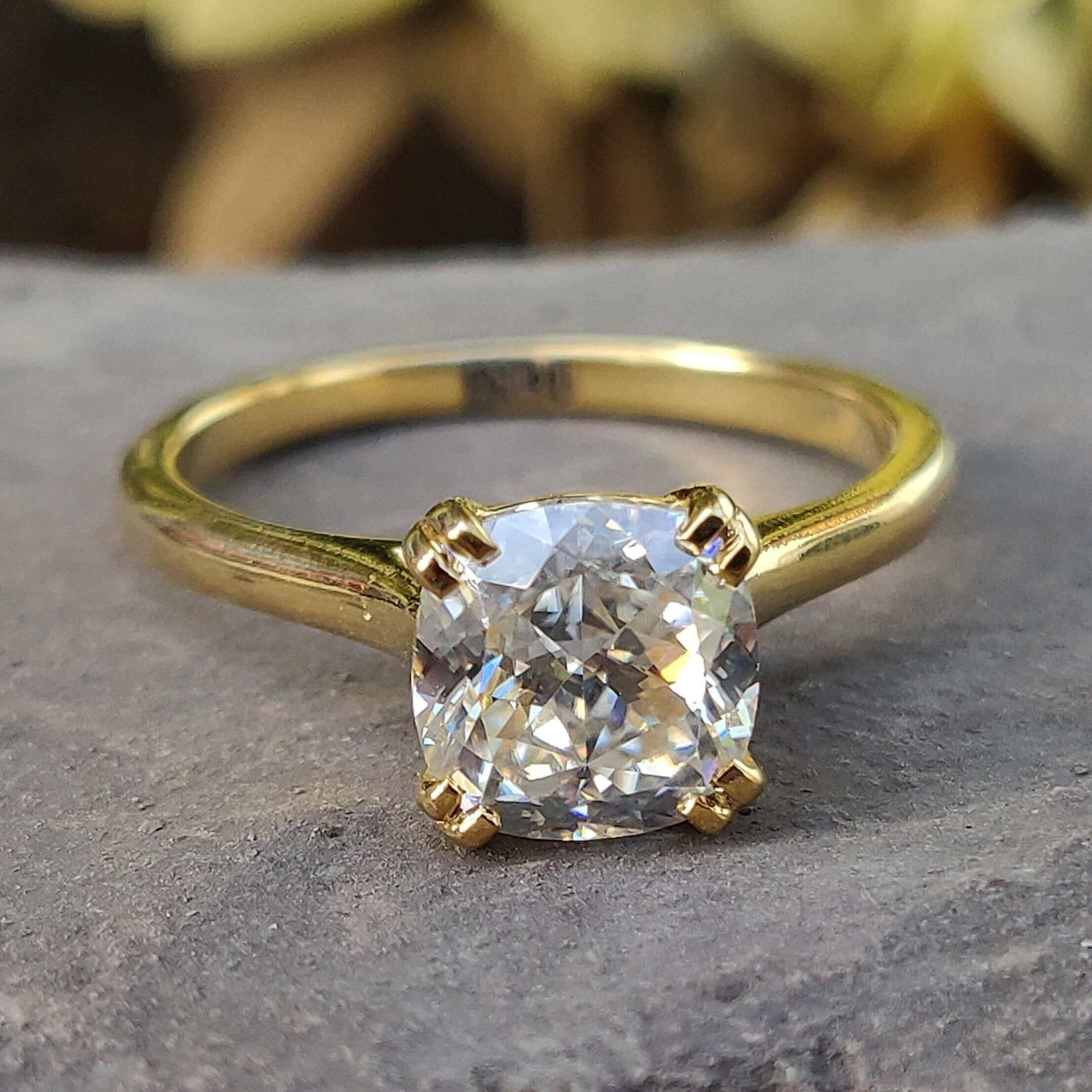 Cushion Cut Solitaire Ring displayed in a beautifully crafted design showcasing the brilliance of the stone.
