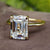 Emerald cut solitaire ring crafted in a stunning yellow gold engagement ring setting.
