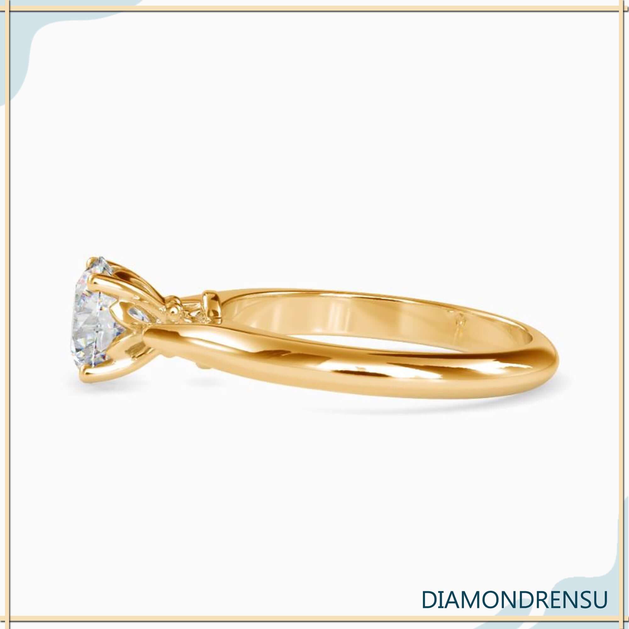 Round solitaire ring with a beautiful knife edge setting for modern elegance.