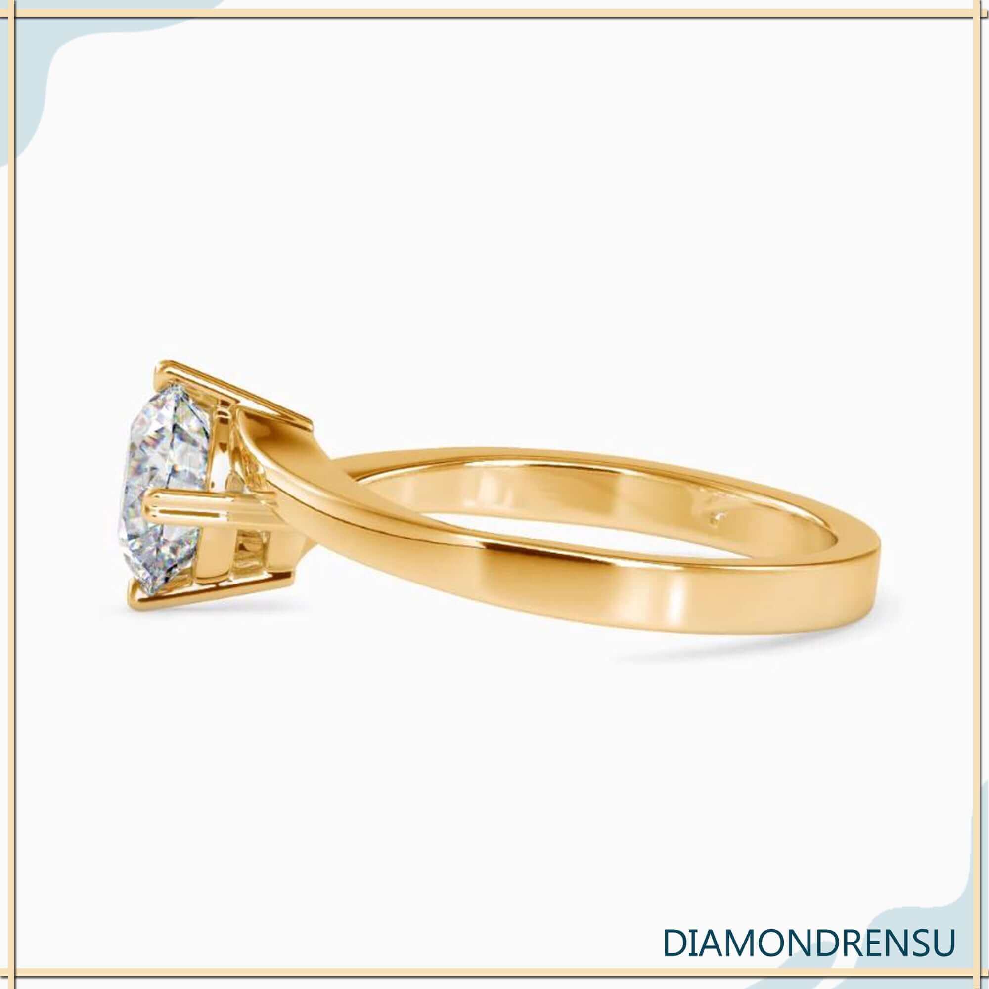 Bypass diamond ring with a round solitaire diamond for timeless beauty.