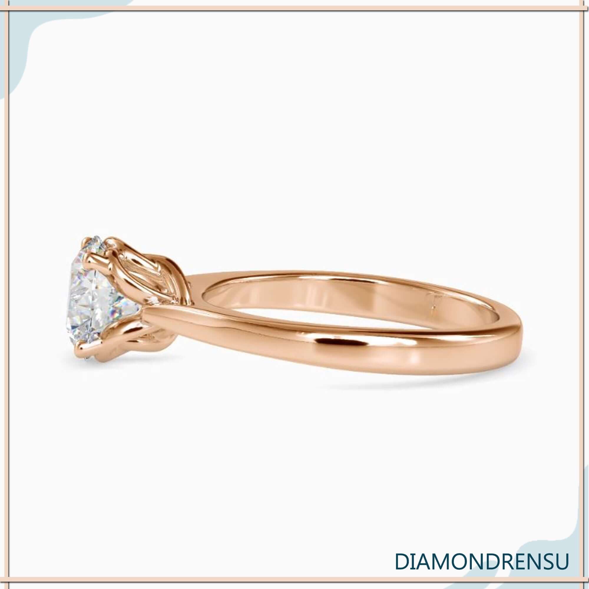 2 ct solitaire diamond engagement ring in a stunning twisted prong basket setting.