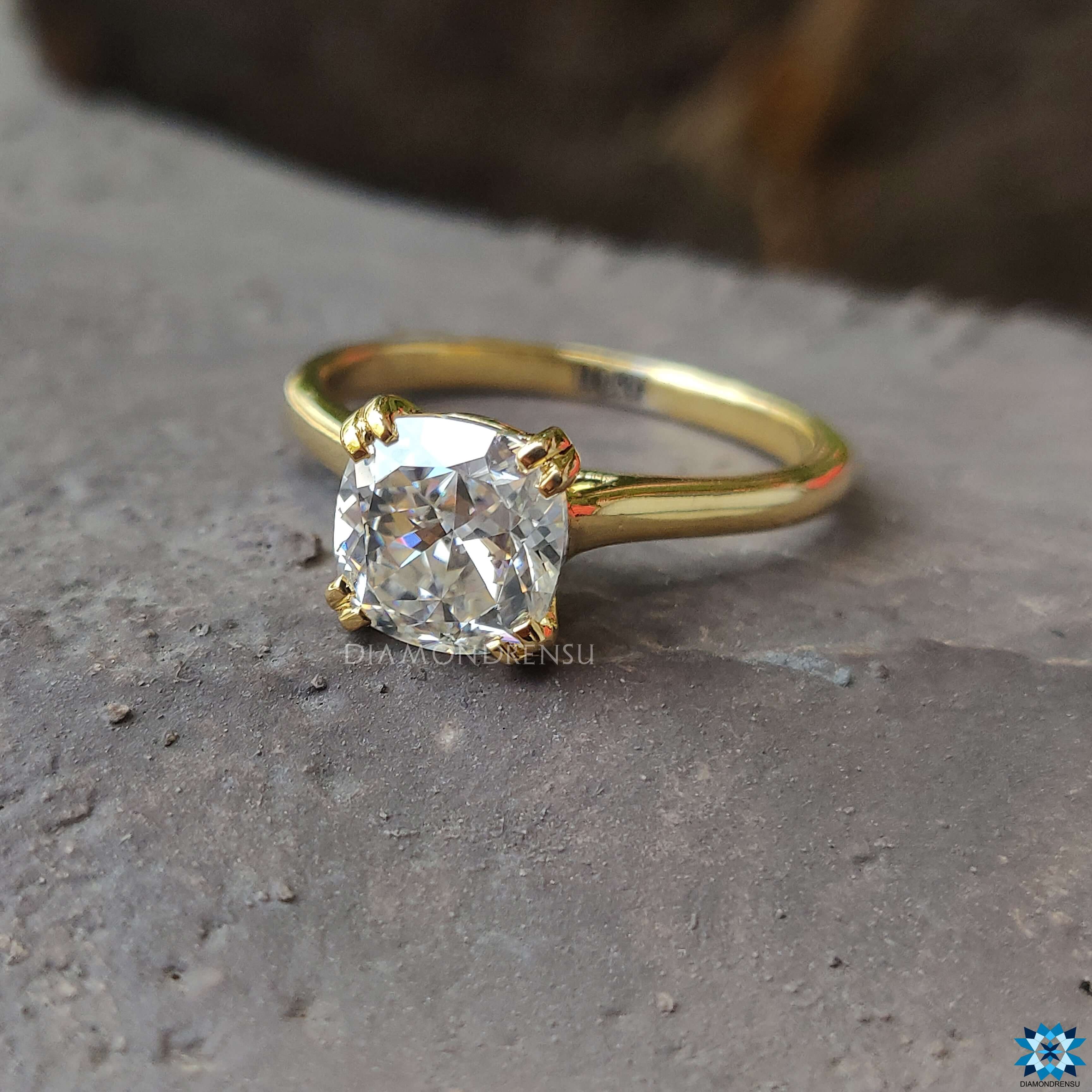 A brilliant Cushion Cut Moissanite set against a delicate band, perfect for any occasion.
