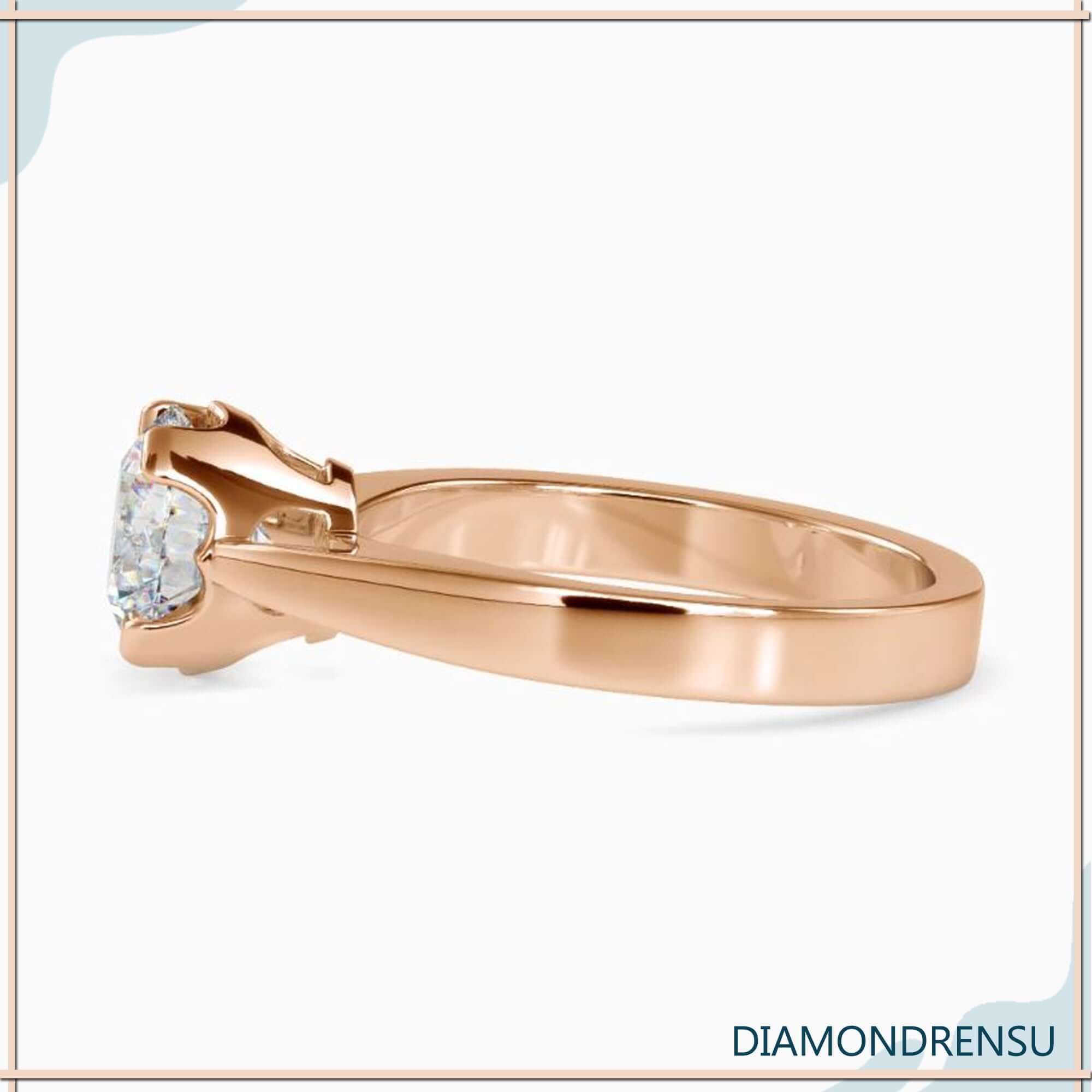 Diamondrensu ring with round solitaire diamond in basket setting.