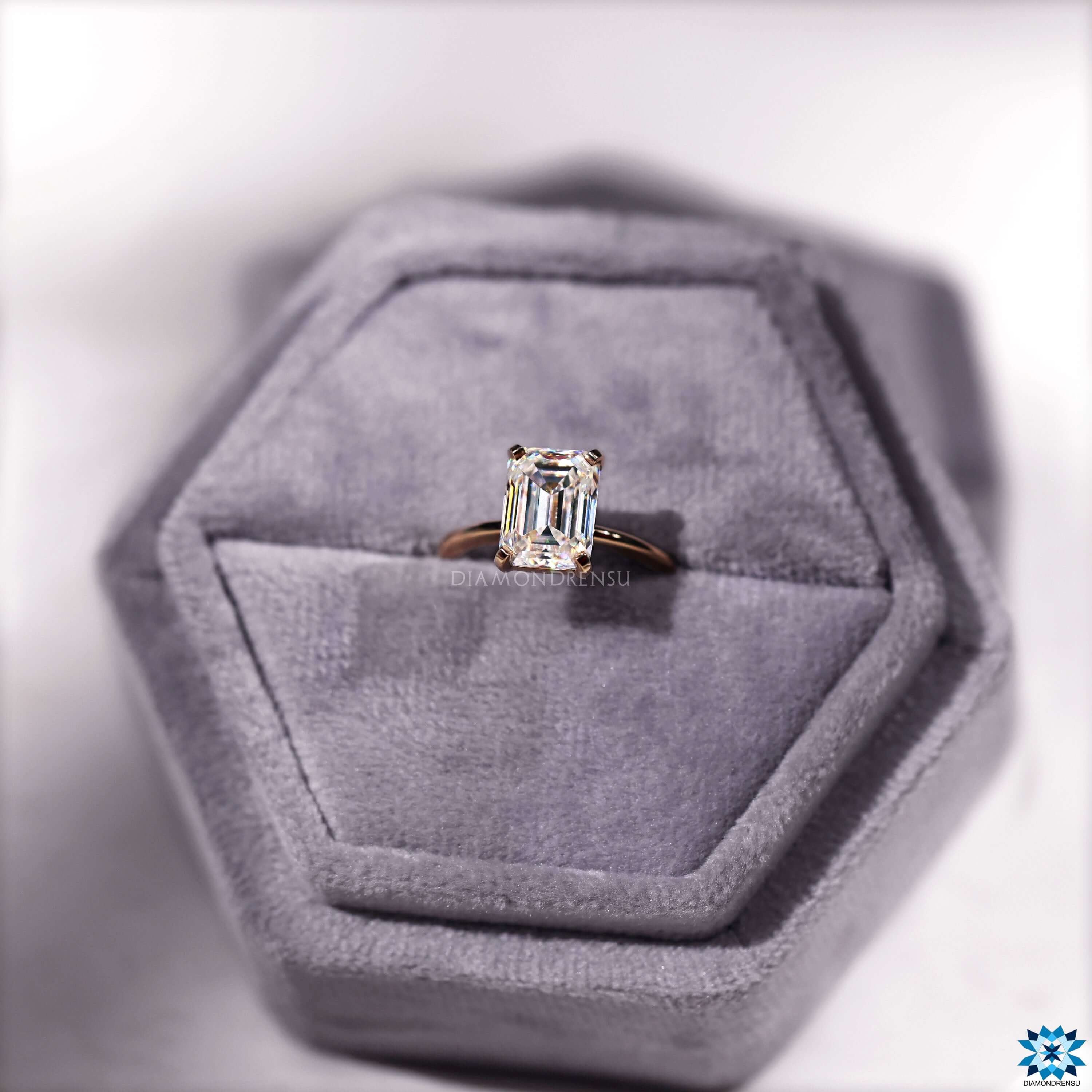 Sparkling moissanite emerald cut​ engagement ring with a sophisticated solitaire style.
