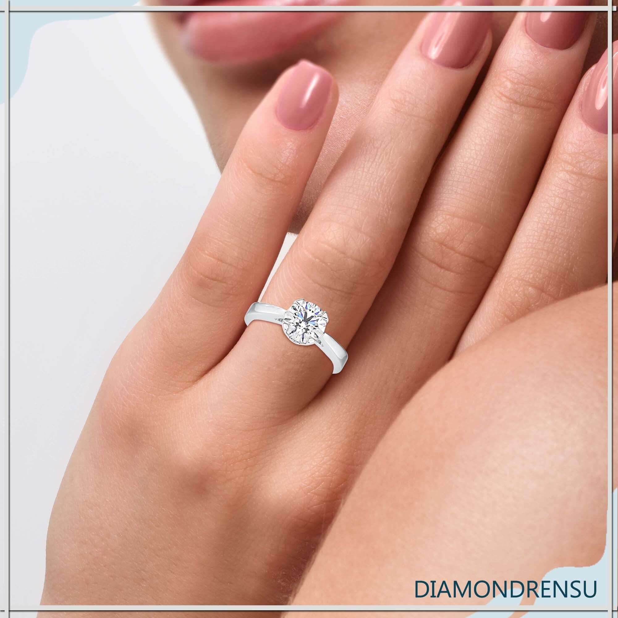 Diamond solitaire ring round in a beautiful handmade design.