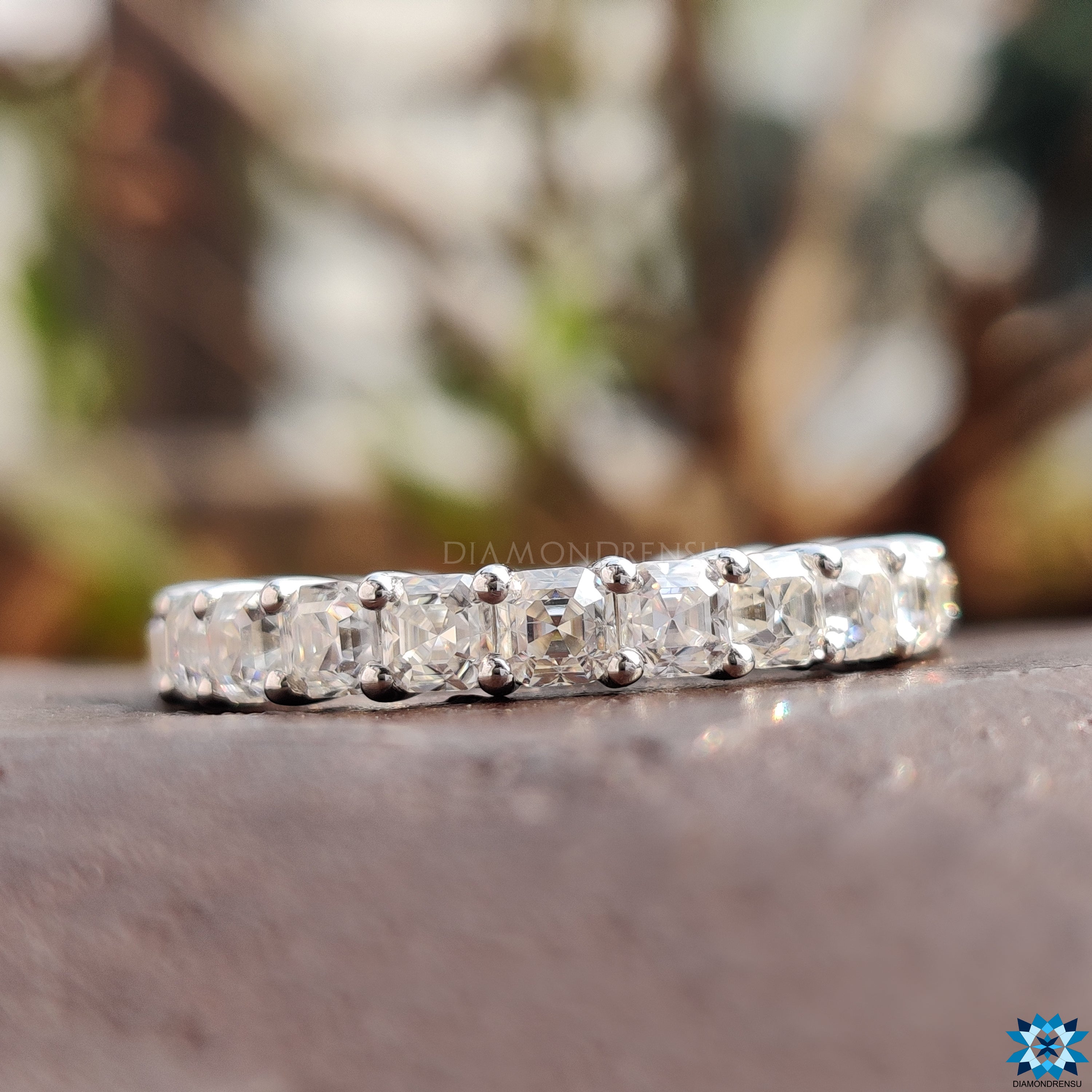 Classic moissanite eternity band with a brilliant finish.