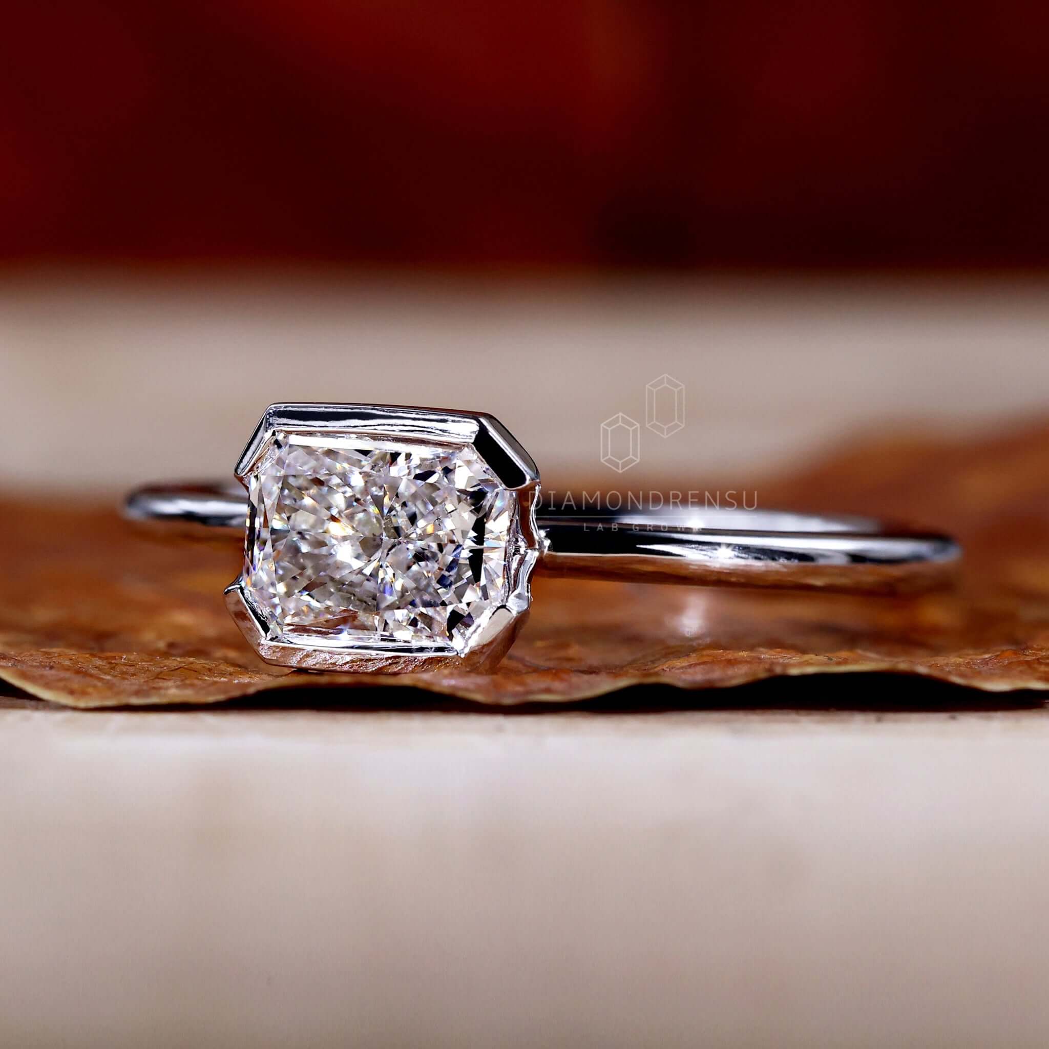 1.01 CT Radiant Cut Lab Grown Diamond Ring, Half Bezel East to West Setting