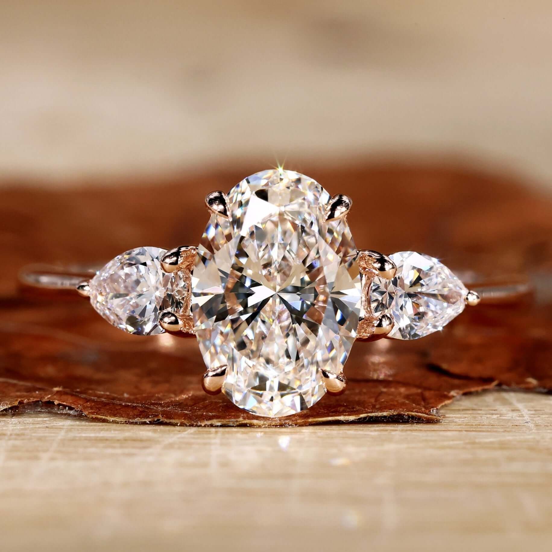 Close-up of an oval diamond ring in a rose gold setting