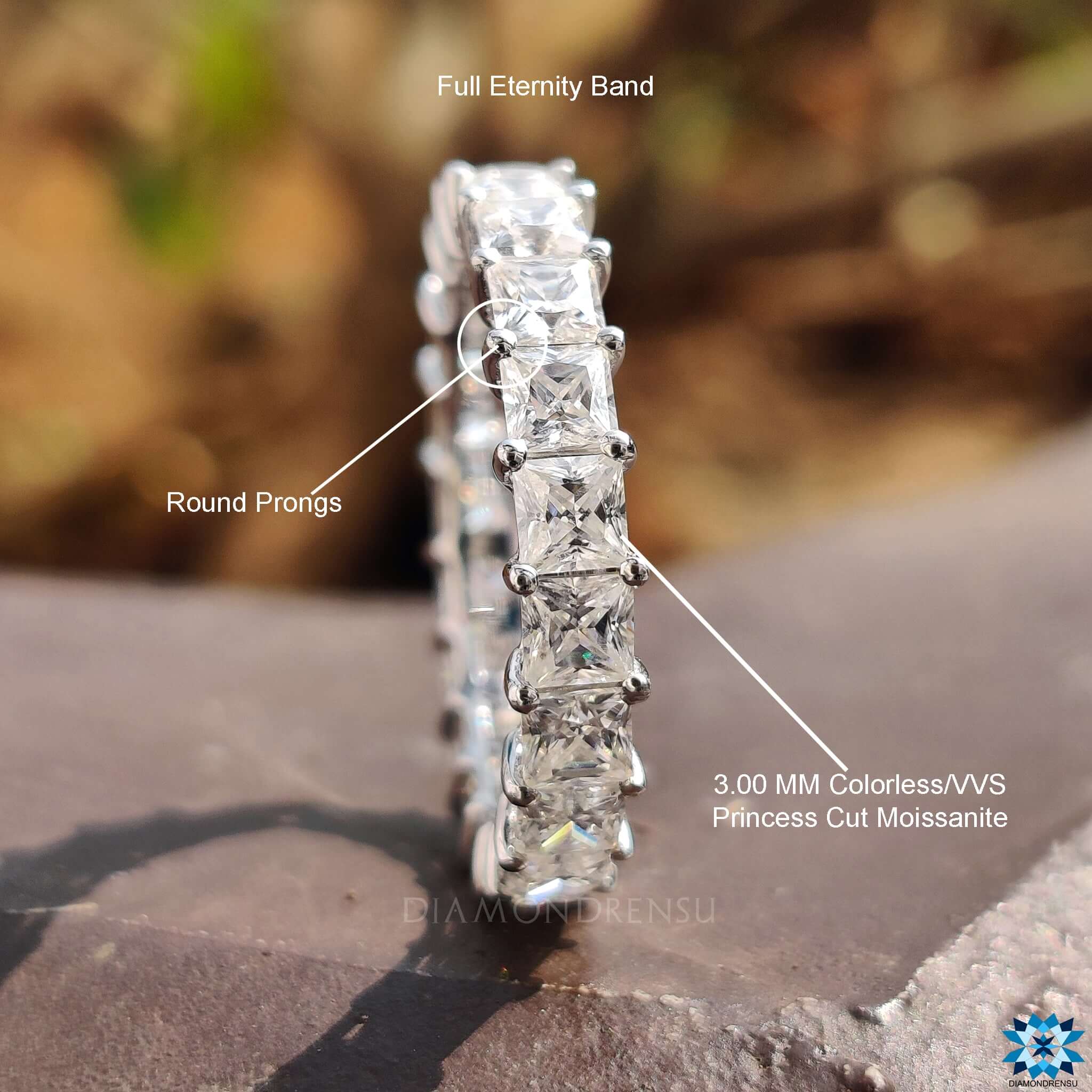 Classic prong setting highlights the beauty of the princess cut stones in this handmade jewelry piece.