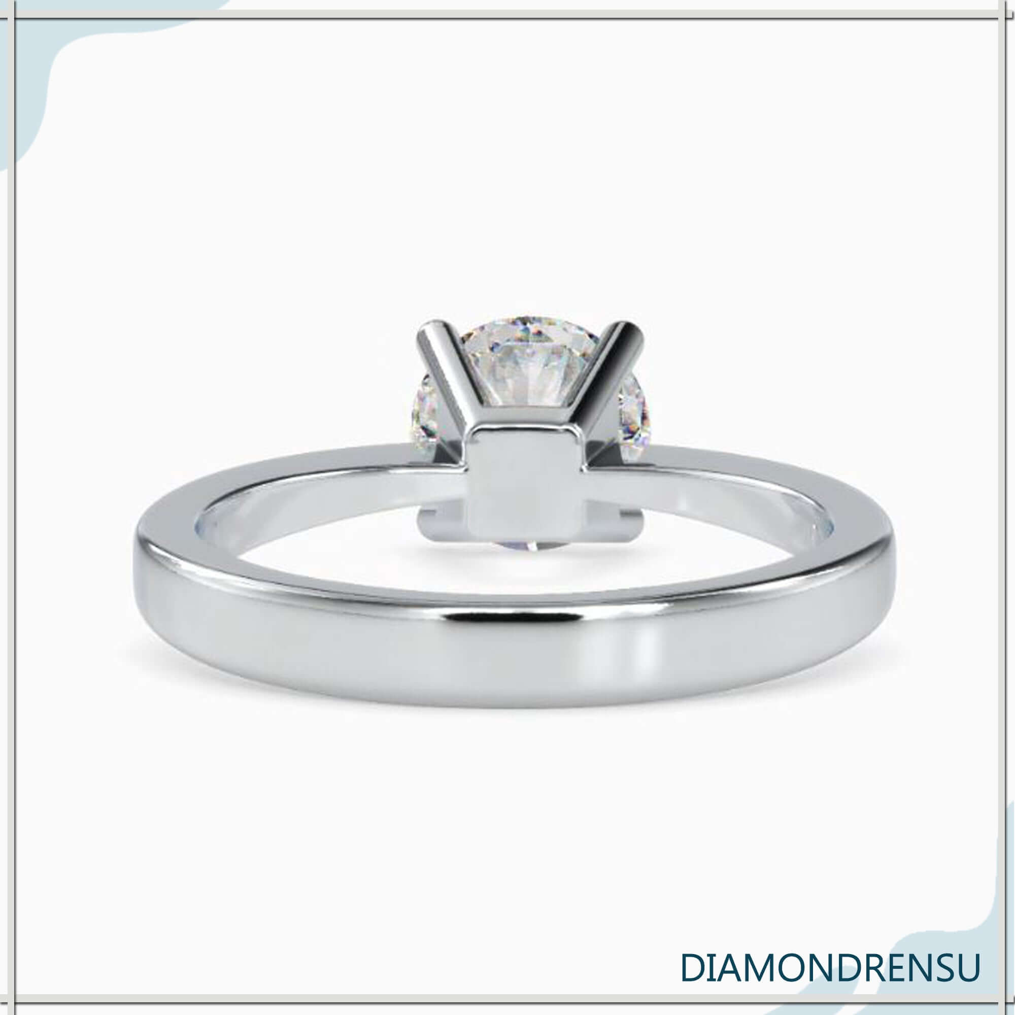 Elegant gold solitaire diamond engagement ring with a basket setting design.