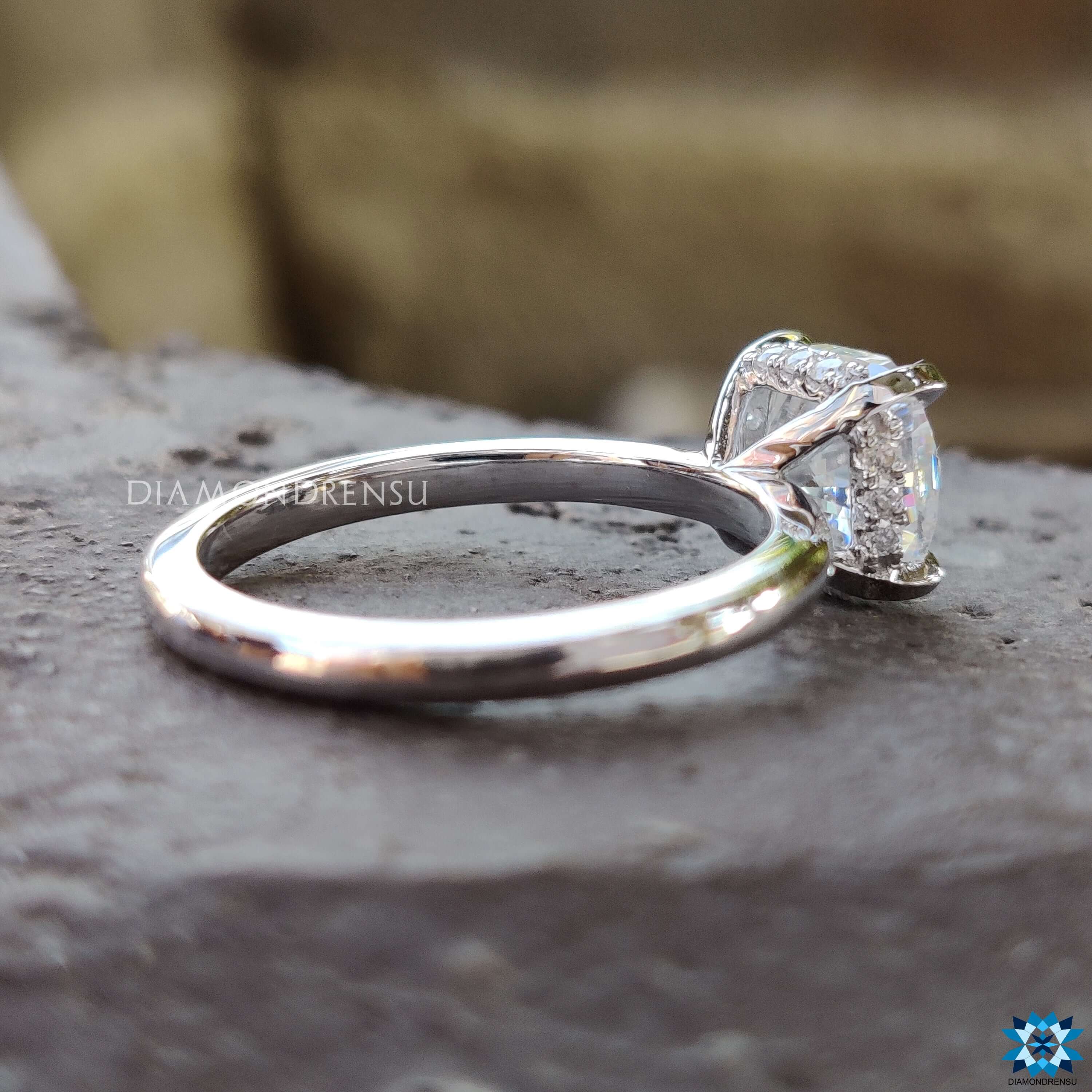 Stylish cushion moissanite ring set in a halo design, enhancing the center stone's sparkle.