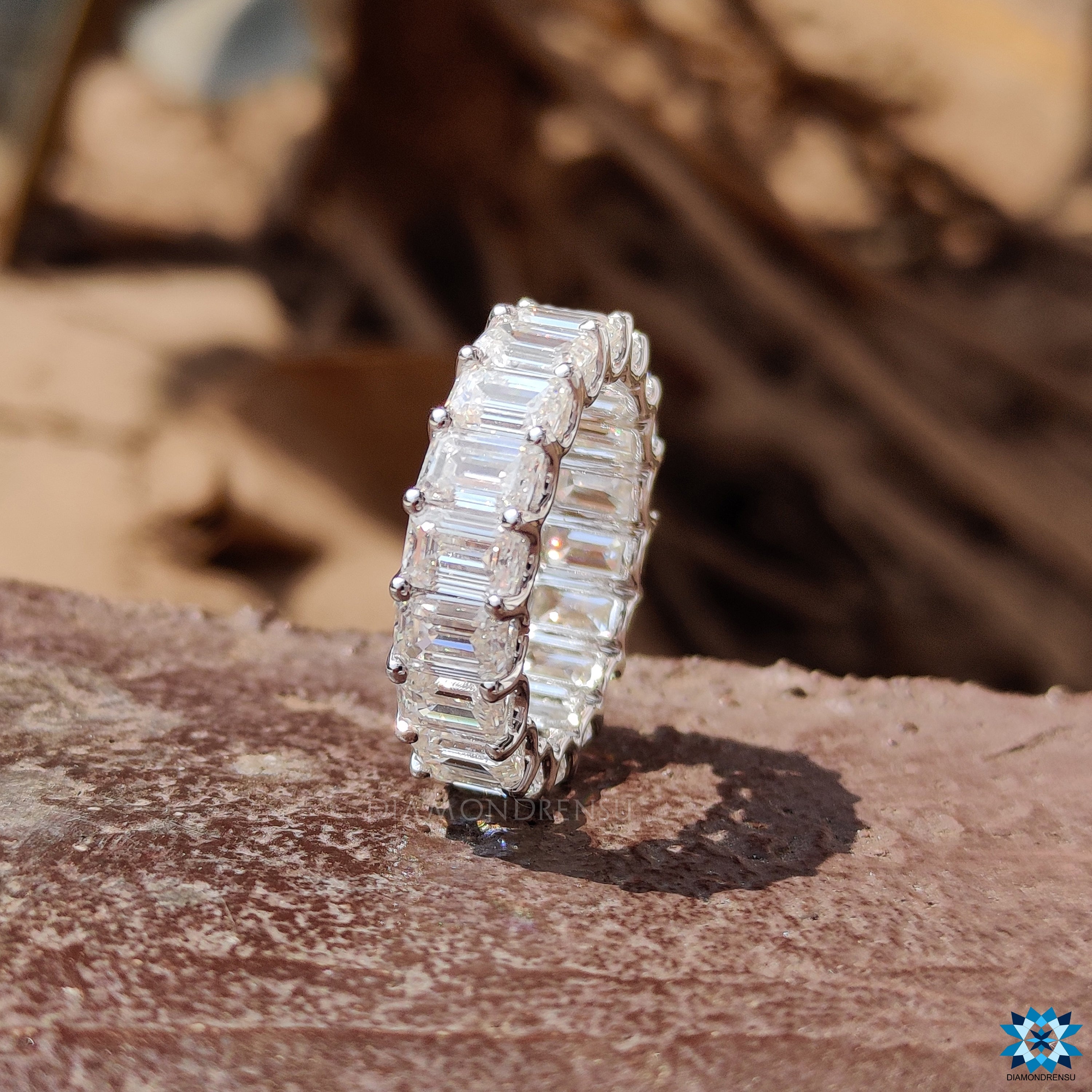 Exquisite emerald cut band in a full eternity style, offering a continuous line of sparkle.