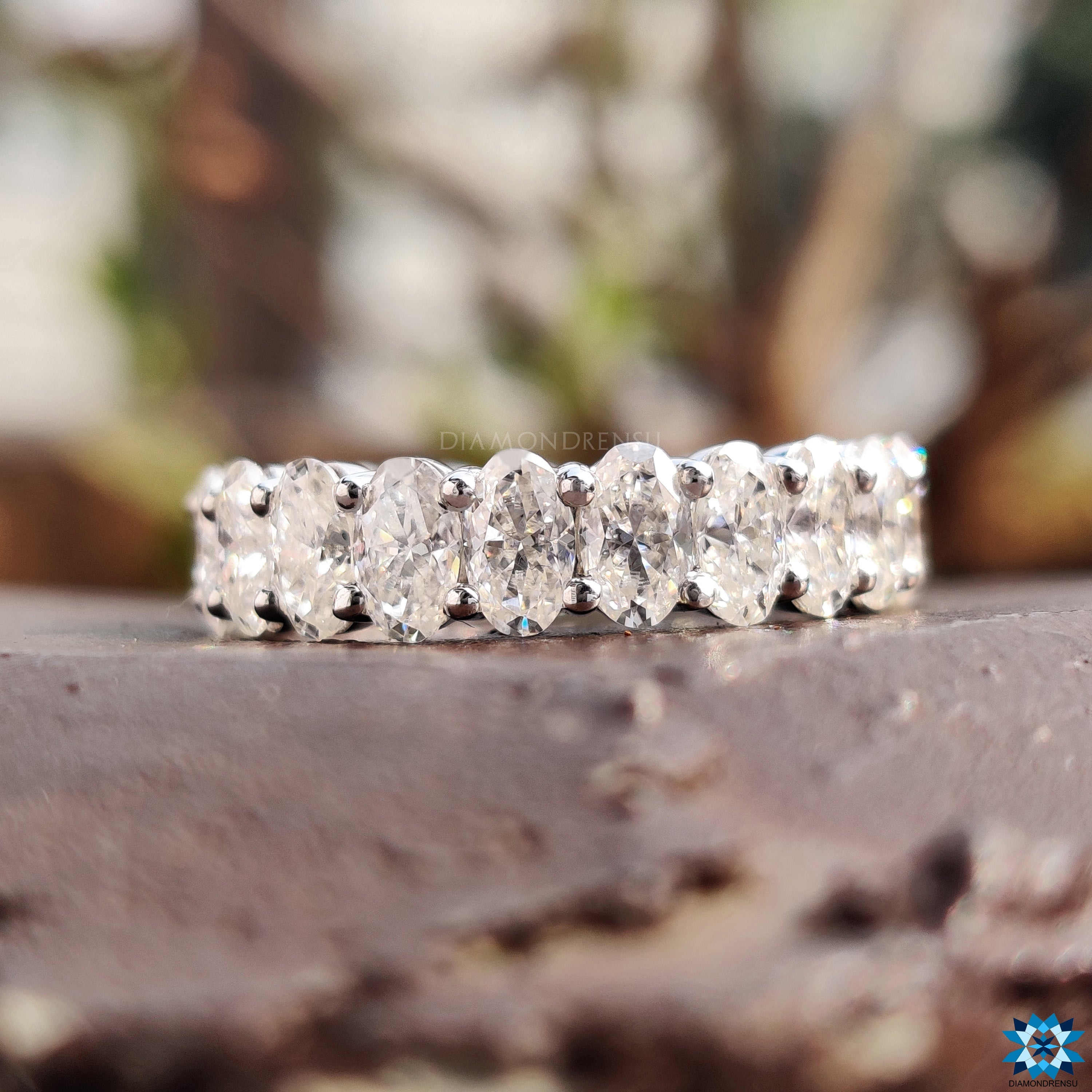 Classic oval diamond band, adding a sophisticated touch to any collection.