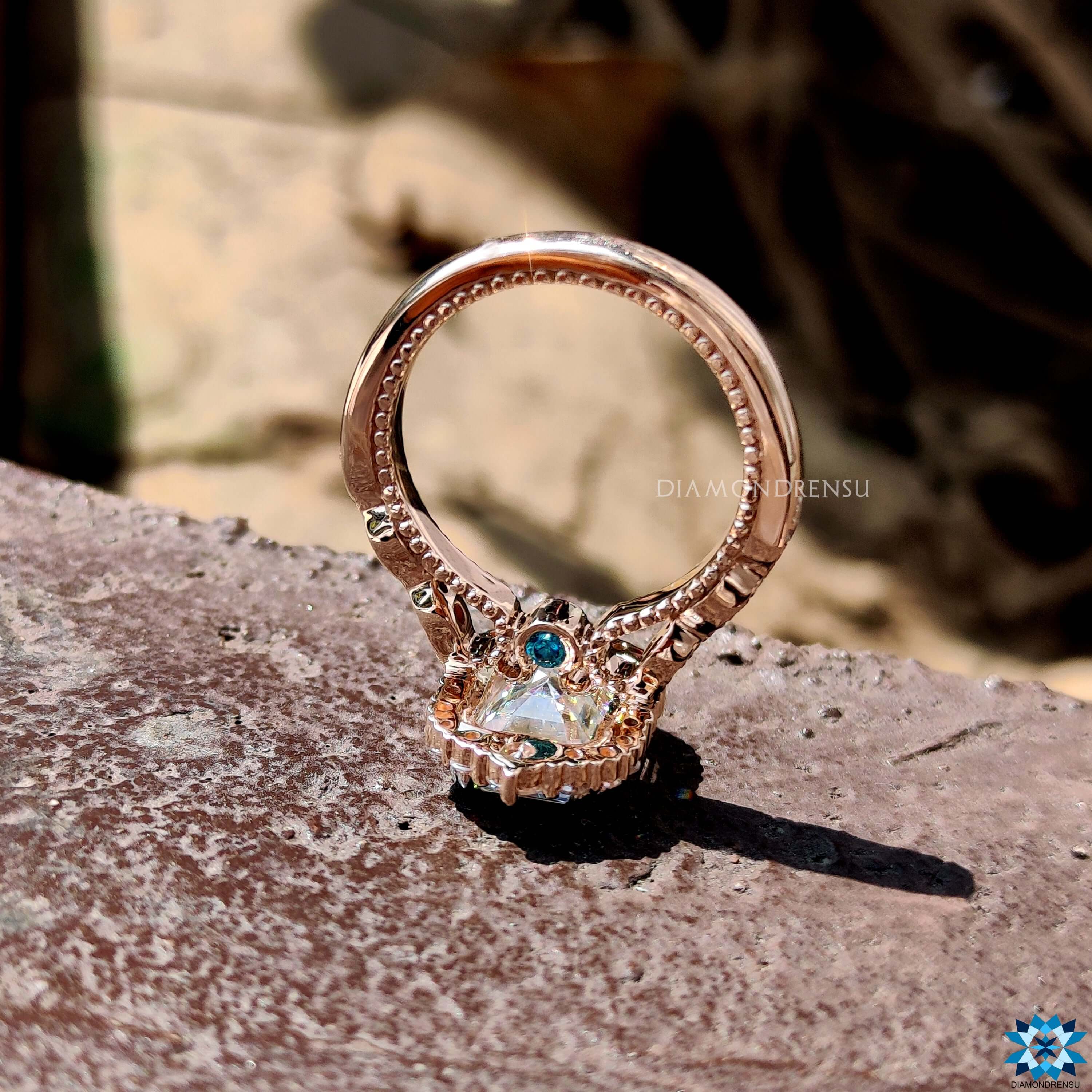 A radiant halo engagement ring featuring a sparkling moissanite center stone, adding an extra touch of brilliance.