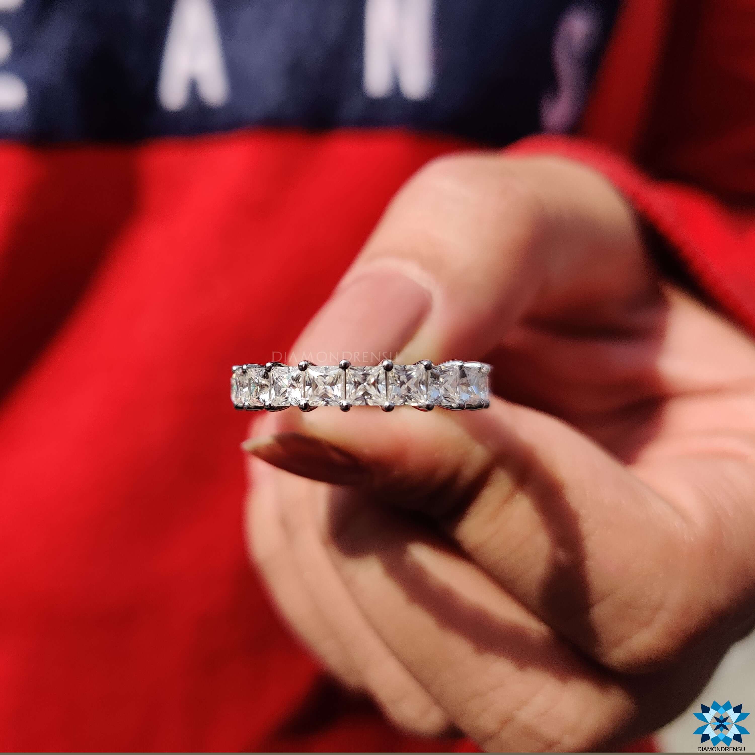 Beautiful square diamond band crafted with high-quality colorless moissanite in a round prong setting.