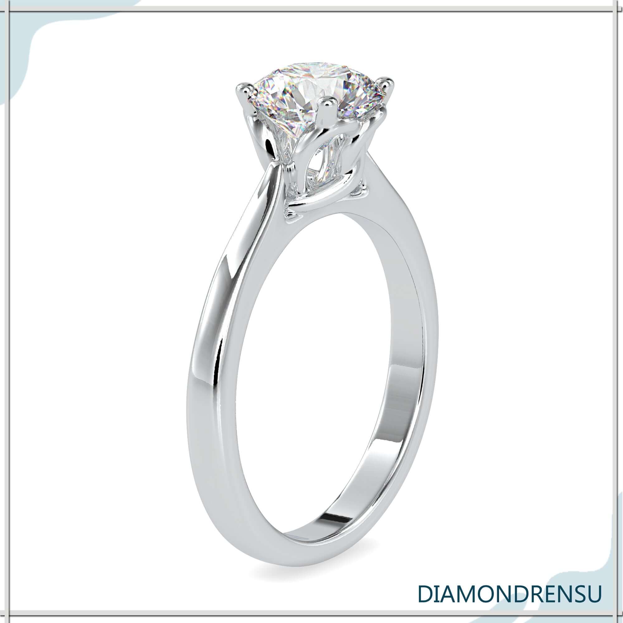 Exquisite solitaire round engagement ring featuring a twisted basket and lab grown diamond.