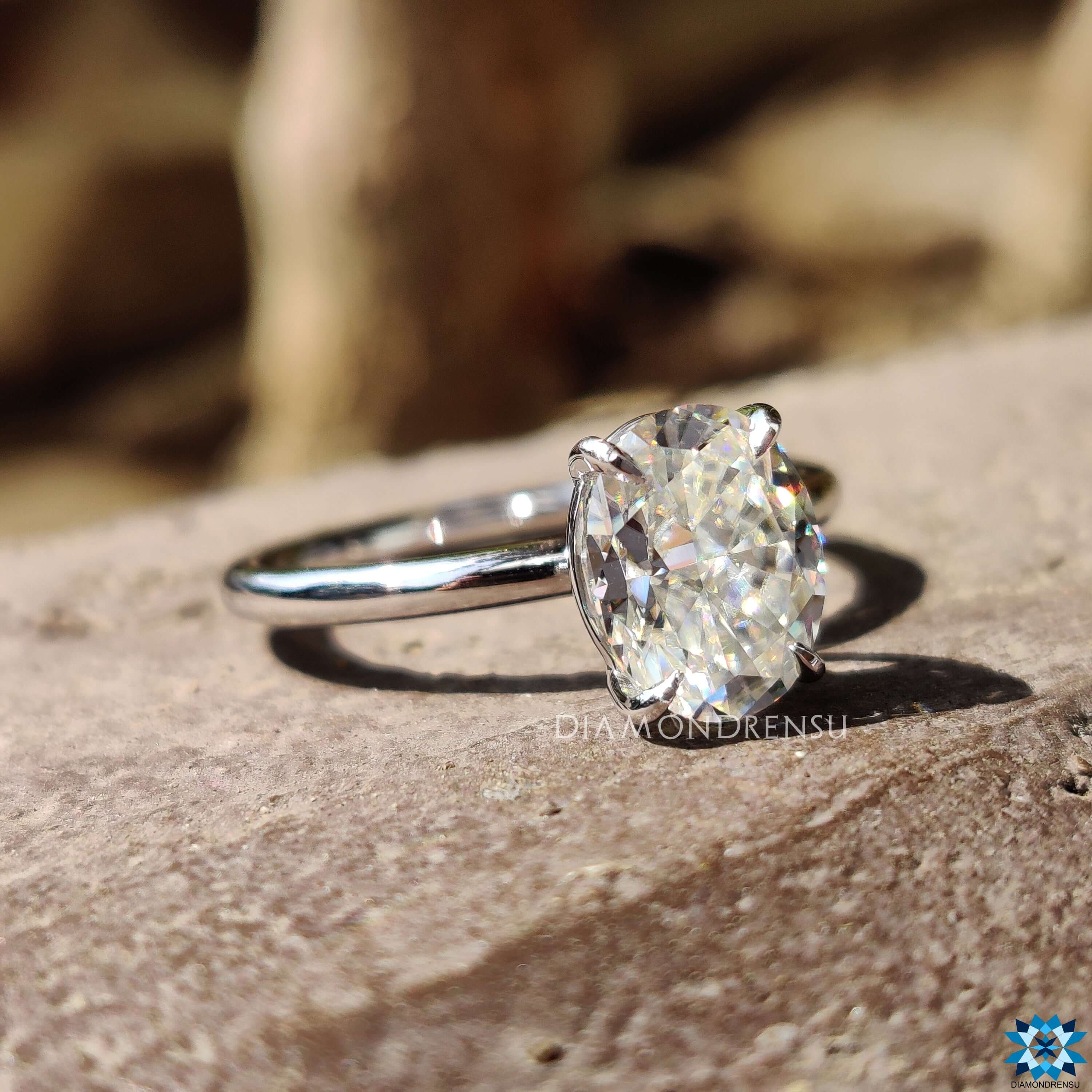 This elegant moissanite solitaire engagement ring features a simple yet stunning design, perfect for any romantic occasion.