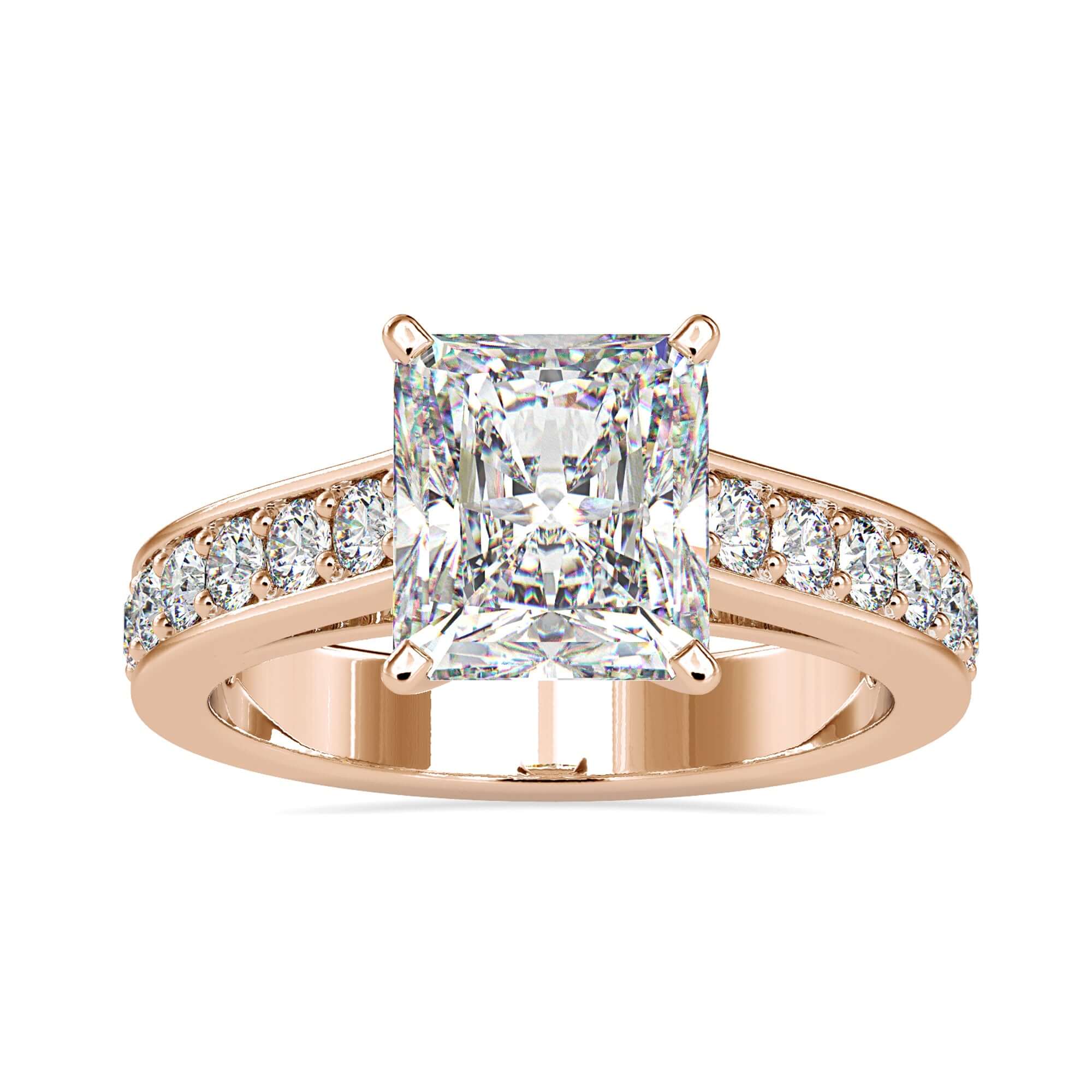 Rose gold radiant cut diamond ring with a cathedral setting
