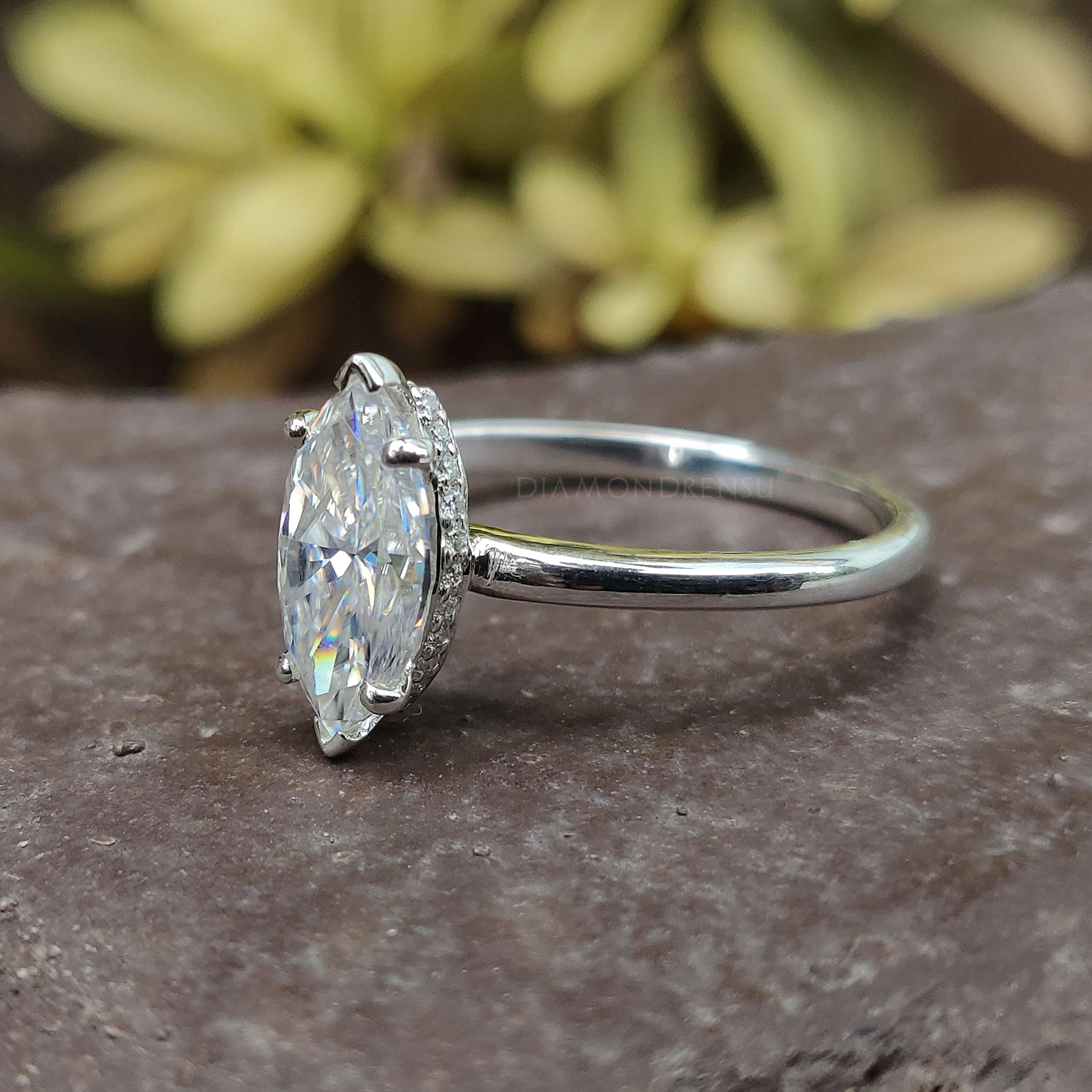 Sparkling marquise moissanite engagement ring with a unique v prong setting for added brilliance