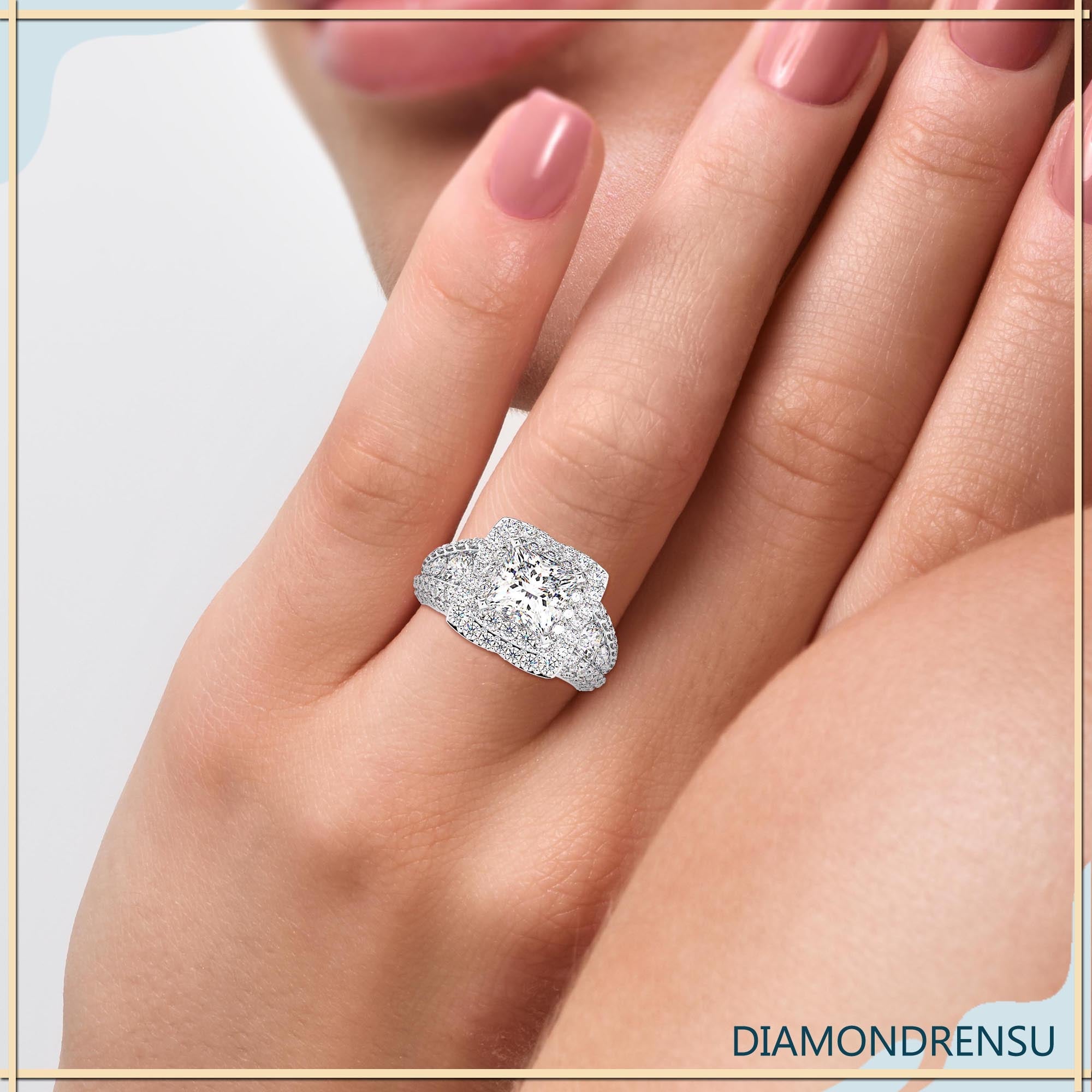 Ring with princess cut diamond showcasing stunning craftsmanship and shine.
