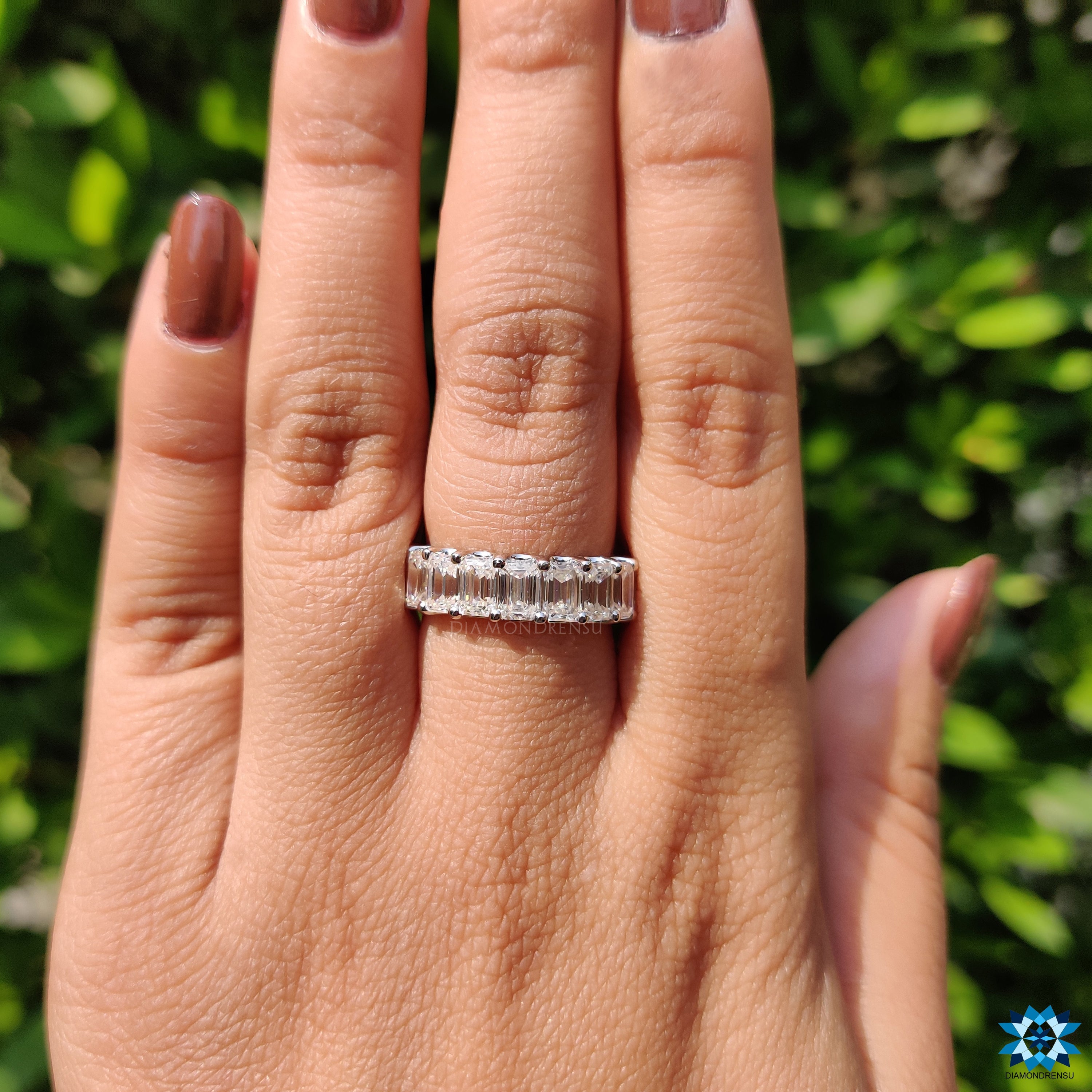 Sparkling moissanite emerald cut stones in a classic handmade band, perfect for everyday wear.